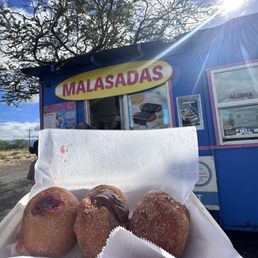 Exterior outside entrance of Manuela Malasada - Big Island - Malasadas with cinnamon+sugar, filling from left to right Strawberry, Nutella, and Lilikoi (passion fruit) - Waimea, Hawaii Exterior outside entrance of Manuela Malasada - Big Island - Malasadas with cinnamon+sugar, filling from left to right Strawberry, Nutella, and Lilikoi (passion fruit) - Waimea, Hawaii
