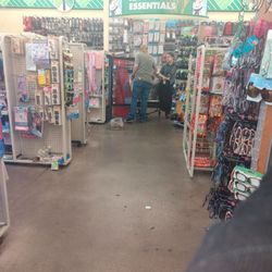 Dollar Tree - Employees, one stocking (gossiping), the other just gossiping back