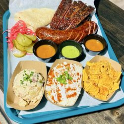 Trevino’s - Ribs, sausage, potato salad, street corn and Mac n cheese! Delicious house made tortilla, onions and pickles