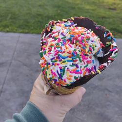 Westview Farm Creamery - Toasted coconut, chocolate dipped waffle cone, with rainbow sprinkles