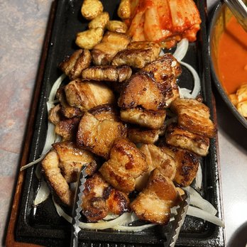 Agit - a plate of meat and vegetables with chopsticks - Korean Near Me - Federal Way, Washington Agit - a plate of meat and vegetables with chopsticks - Korean Near Me - Federal Way, Washington