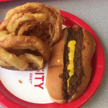 The Varsity - One of the chili dogs and order of onion rings. (That is mustard not cheese.....I was hoping it was cheese) - Burgers Near Me - Atlanta, Georgia
