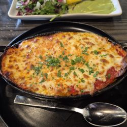 Zucca Gastrobar - HOMEMADE LASAGNA house made pasta layered with bolognese & bechamel topped with parmesan & fontina