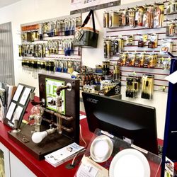City Electric Supply Long Beach - A view of the counter stocked with Klein tools and product demonstrations.