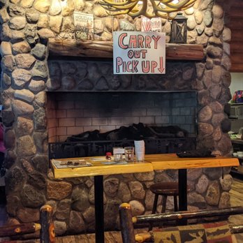 Gilbert's Lodge - a stone fireplace in a restaurant - Sports Bars Near Me - Saint Clair Shores, Michigan