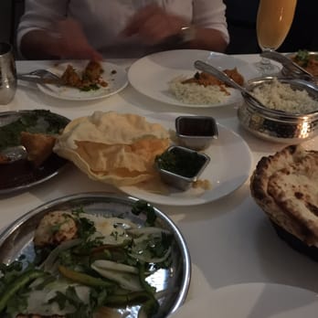 Yaar Indian Restaurant - Vegetable samosa, malai chicken in front, papadum (crispy chips) chicken tikka masala, rice and cheese naan. All delicious - Indian Near Me - Astoria, New York