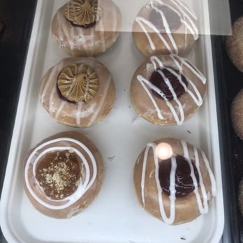 Donutly - One the left peanut butter and jelly on top apple pie on the bottom - Donuts Near Me - Denton, Texas