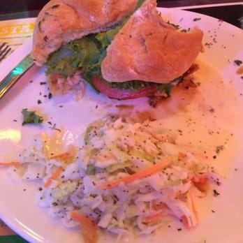 Tail-Gators Brews & Grill - Teriyaki mahi sandwich with coleslaw, misding a bite! - American Near Me - Port St. Lucie, Florida Tail-Gators Brews & Grill - Teriyaki mahi sandwich with coleslaw, misding a bite! - American Near Me - Port St. Lucie, Florida