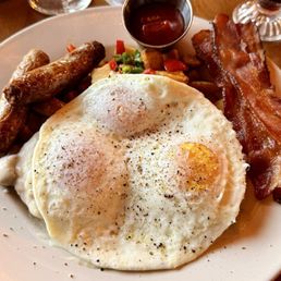 Biscuits and Gravy with 3 OE easy eggs, sausage and bacon.