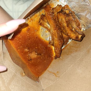 Kitchen AF - A pool of sauce, ruined the flavor. Just dry hard meat with a TON hot and garlic sauce. - American Near Me - Winter Park, Florida