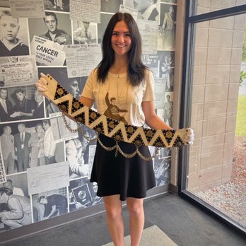 Graceland - Me holding Elvis's belt!! I cried but not on the belt lol - Museums Near Me - Memphis, Tennessee