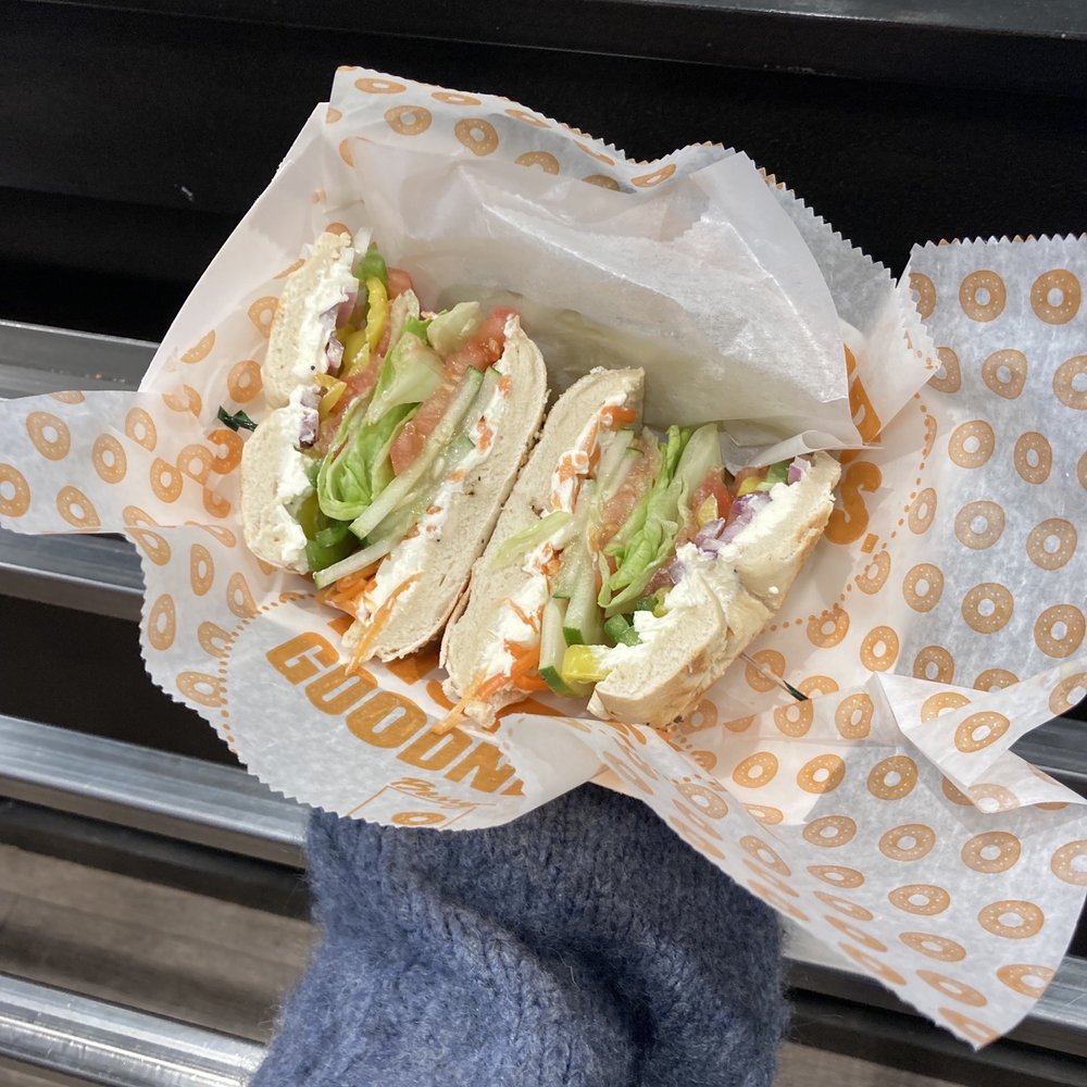 Barry Bagels - a person holding a sandwich - Bagels Near Me - Ann Arbor, Michigan Barry Bagels - a person holding a sandwich - Bagels Near Me - Ann Arbor, Michigan