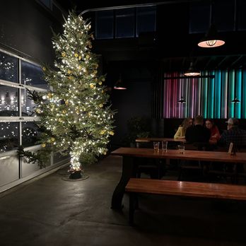 Kimi's - a christmas tree in a dark room - Bars Near Me - Providence, Rhode Island