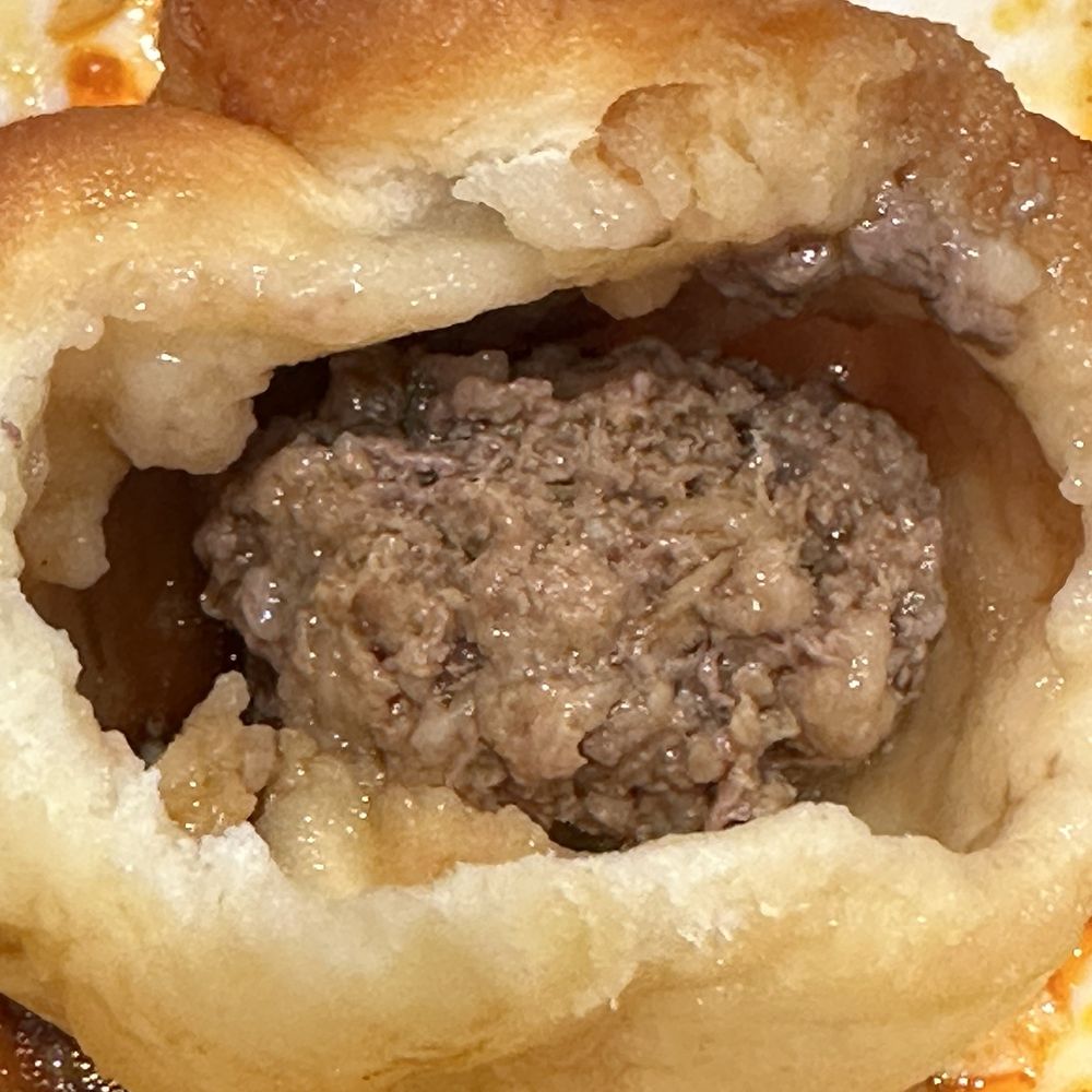 Super Dumpling - Inside the beef bun- beef is teeny tiny and  too dry. Way more dough to meat ratio - Noodles Near Me - Orange, California