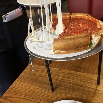 Giordano's - Cheese pull - Pizza Near Me - Chicago, Illinois Giordano's - Cheese pull - Pizza Near Me - Chicago, Illinois