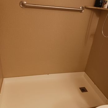 ADL Solutions, Inc. - This is the rollin shower.  There is a very sturdy rubber that I just roll the shower chair over. - Kitchen & Bath Near Me - Chandler, Arizona