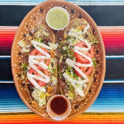 El Taco’Queto Restaurant - Huaraches: Comes with the meat of your choice, lettuce, tomato, cheese, and sour cream on a masa dough base.