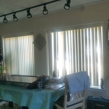 Astro Shutters - Before photo - vertical blinds in two large windows - Shutters Near Me - Riverside, California