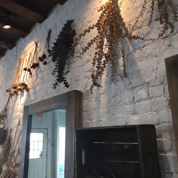 Berry - Dried flowers on the gorgeous white wall - Hair Salons Near Me - Brooklyn, New York