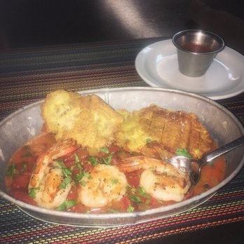 Andes Cafe - YUMMY!!! "Tostones con Hogao de Camaron" The fried green plantains taste amazing with the white onion tomato sauce! A great appetizer! - Latin American Near Me - Houston, Texas