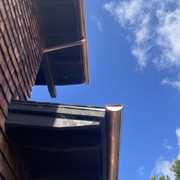 Nearly a 40 foot drop. New gutters tied into an old system. Nearly a 40 foot drop. New gutters tied into an old system.
