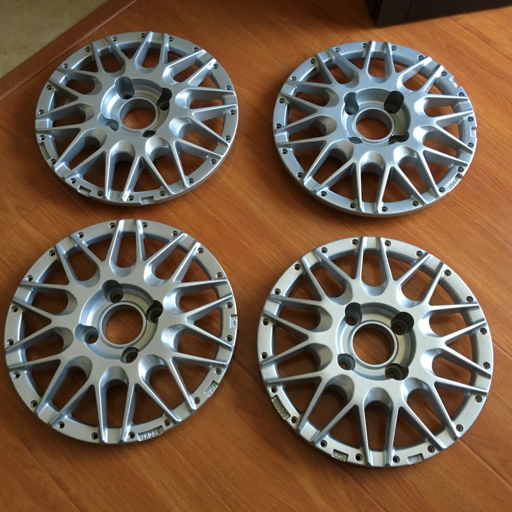 Wheel Cosmo - These mesh wheel faces had several different colors of paint on them. Raffi and his crew stripped and repowdercoated them. Clean! - Wheel & Rim Repair Near Me - Azusa, California Wheel Cosmo - These mesh wheel faces had several different colors of paint on them. Raffi and his crew stripped and repowdercoated them. Clean! - Wheel & Rim Repair Near Me - Azusa, California
