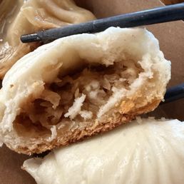 Inside the bao bun. Not sure but I think it was vegetables inside. Soft and fluffy with a nice crunchy bottom. Inside the bao bun. Not sure but I think it was vegetables inside. Soft and fluffy with a nice crunchy bottom.
