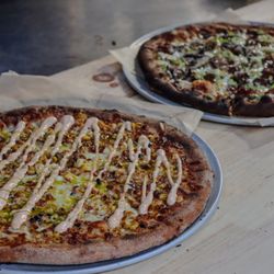 Fogtown Brewing Company - One of our most popular pies, the 'Elote', made with fire-roasted corn, spicy crema & cilantro oil.