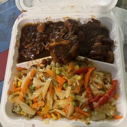 G & H Caribbean Restaurant - Oxtails with the cabbage that needed more understanding