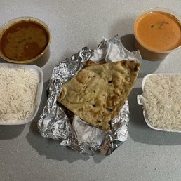 Chicken curry(left), garlic naan and butter chicken(right) Chicken curry(left), garlic naan and butter chicken(right)