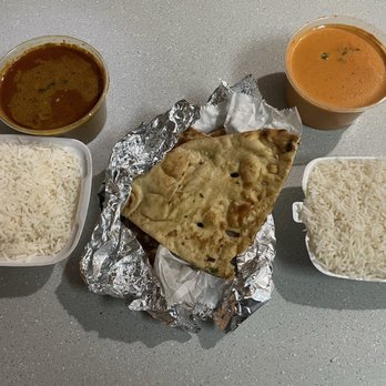 Jhapali Kitchen & Bar - Chicken curry(left), garlic naan and butter chicken(right) - Indian Near Me - Pickerington, Ohio Jhapali Kitchen & Bar - Chicken curry(left), garlic naan and butter chicken(right) - Indian Near Me - Pickerington, Ohio