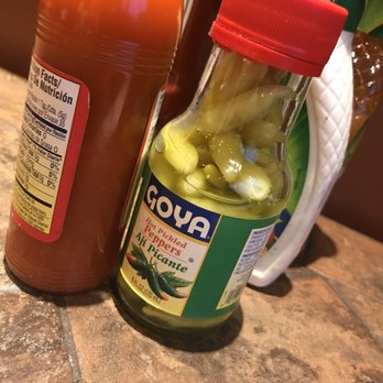 Tapatio Mexican Grill - a bottle of hot sauce and a jar of pickles - Mexican Near Me - Somerville, Massachusetts Tapatio Mexican Grill - a bottle of hot sauce and a jar of pickles - Mexican Near Me - Somerville, Massachusetts