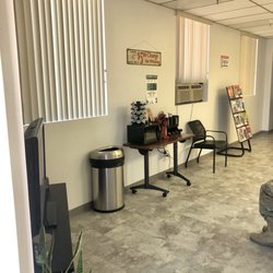 Cece’s Barber Shop - Casual waiting room with coffee and magazines.