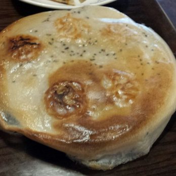 LanZhou Ramen - Pork pan fried buns. Was expecting buns, but they are really dumplings underneath the exterior crust. - Chinese Near Me - Doraville, Georgia LanZhou Ramen - Pork pan fried buns. Was expecting buns, but they are really dumplings underneath the exterior crust. - Chinese Near Me - Doraville, Georgia