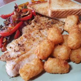 Grilled Grouper with tots and sauteed mushrooms, onions, and peppers Grilled Grouper with tots and sauteed mushrooms, onions, and peppers
