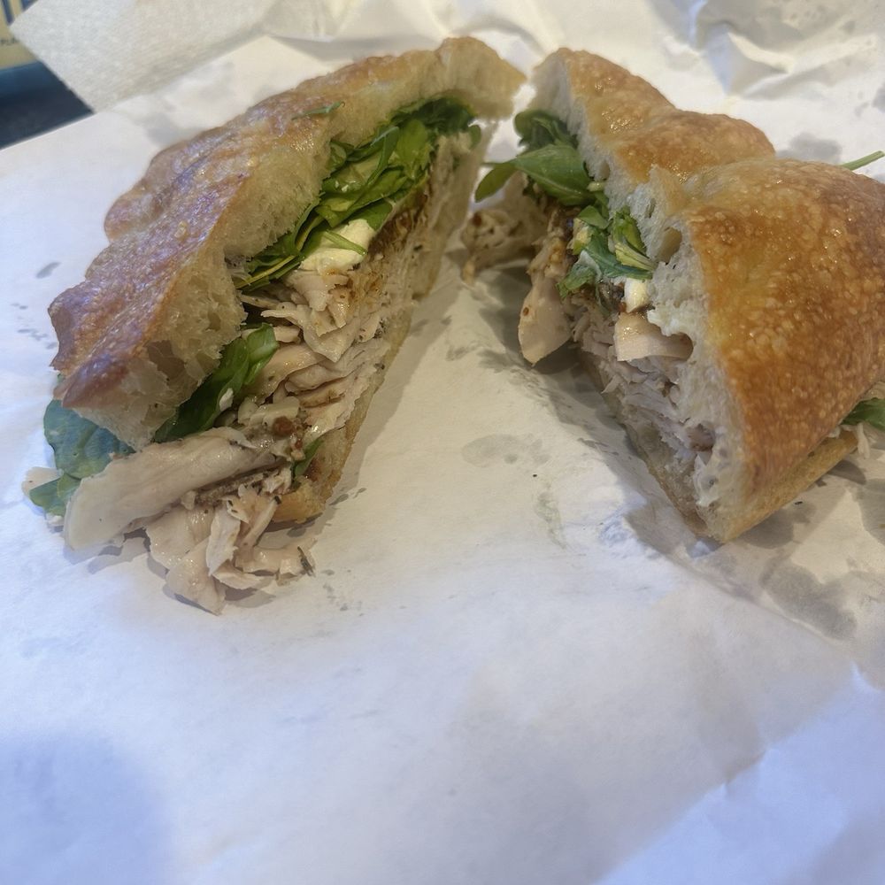 First & Last - Bob Sacramano sandwich with fennel rubbed turkey, orange Calabrian monstarda, Brie and arugula - Italian Near Me - Phoenix, Arizona