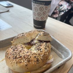 Rebel Dog Coffee - Bacon and egg on an everything bagel with a large coffee with bourbon vanilla syrup