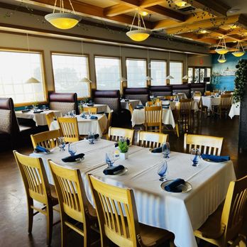Yanni's Restaurant - Very attractive interior with light wood, white tablecloths, blue glasses and linen napkins, lots of windows. - Venues & Event Spaces Near Me - Nampa, Idaho Yanni's Restaurant - Very attractive interior with light wood, white tablecloths, blue glasses and linen napkins, lots of windows. - Venues & Event Spaces Near Me - Nampa, Idaho
