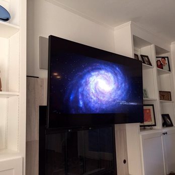 Chicago TV Installer - Pull down fire place installation - Home Theatre Installation Near Me