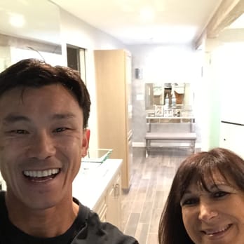 SR Design and Construction - a man and a woman in a kitchen - General Contractors Near Me - Huntington Beach, California SR Design and Construction - a man and a woman in a kitchen - General Contractors Near Me - Huntington Beach, California