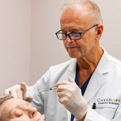 Chernoff Cosmetic Surgery - Dr. Chernoff performing Botox injections on a patient.