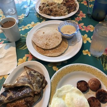 808 Grindz Cafe - Top: kalua hash with fried rice and eggs Middle: pancakes Bottom: ube french toast with eggs and Portuguese sausage - Cafes Near Me - Lahaina, Hawaii