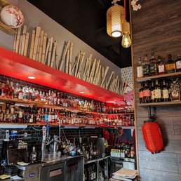 Iza Whiskey & Eats - Inside. Whiskey selection at the bar. - interior - Sushi Bars Near Me - Carrboro, North Carolina