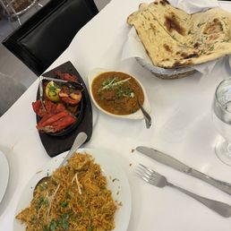 Tandoori Chicken, Chicken Biryani, Garlic Naan, Fish Curry. Really delicious! Tandoori Chicken, Chicken Biryani, Garlic Naan, Fish Curry. Really delicious!