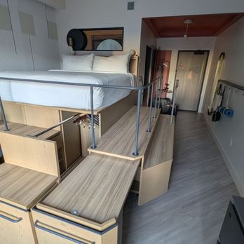 Catbird Hotel - Raised bed with pullout desk and closet underneath - Hotels Near Me - Denver, Colorado