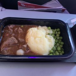 Virgin Australia - Beef gravy (they called it curry) with mashed potatoes and peas. It was quite delicious actually.