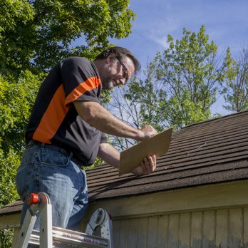 Bulldog Property Services - a man working on a roof - General Contractors Near Me Bulldog Property Services - a man working on a roof - General Contractors Near Me