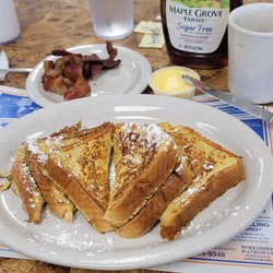 Sunshine Cafe - 06/03/23 Perfect French toast lightly dusted with powdered sugar Bacon Cawfee
