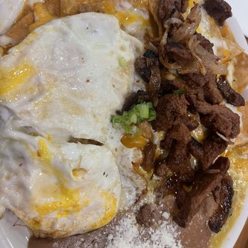 Loaded Cafe - Bellflower - Very small amount of carne Asada Chilaquiles Plate for $24. - Breakfast & Brunch Near Me - Bellflower, California Loaded Cafe - Bellflower - Very small amount of carne Asada Chilaquiles Plate for $24. - Breakfast & Brunch Near Me - Bellflower, California