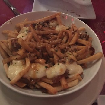 Goat's - Poutine with duck confit - Cocktail Bars Near Me - Columbia, South Carolina Goat's - Poutine with duck confit - Cocktail Bars Near Me - Columbia, South Carolina